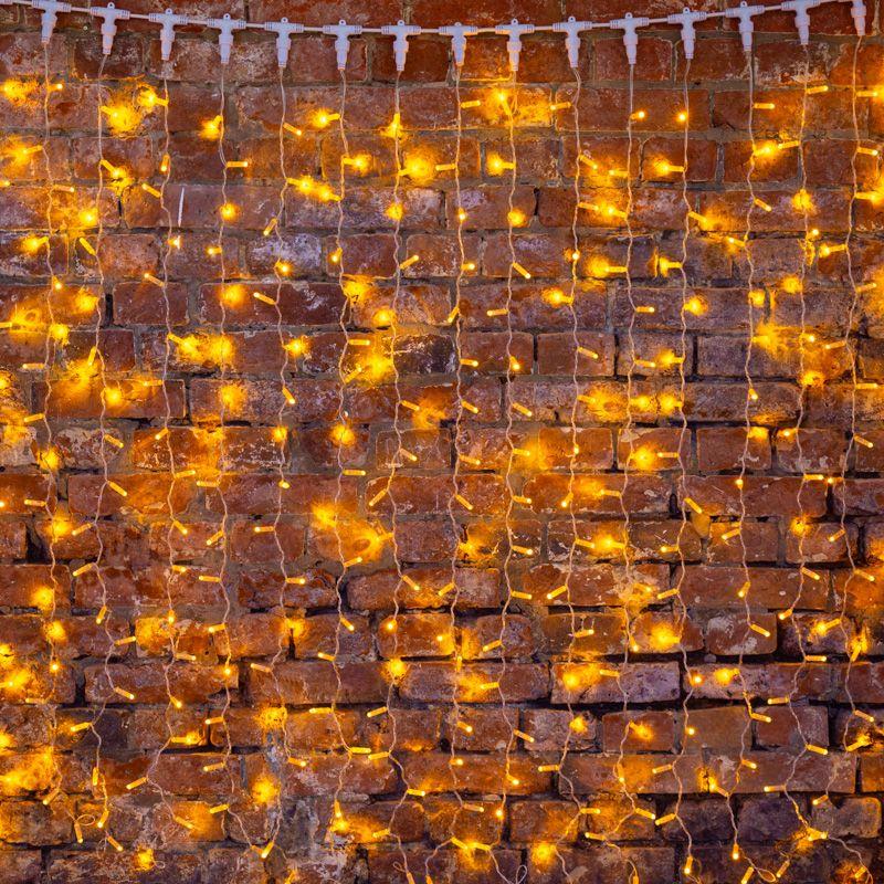  Гирлянда светодиодная "Светодиодный Дождь" 2х1.5м 300LED желт. 23Вт 230В IP65 постоян. свечение провод прозр. Neon-Night 235-301 фото в каталоге от BTSprom.by