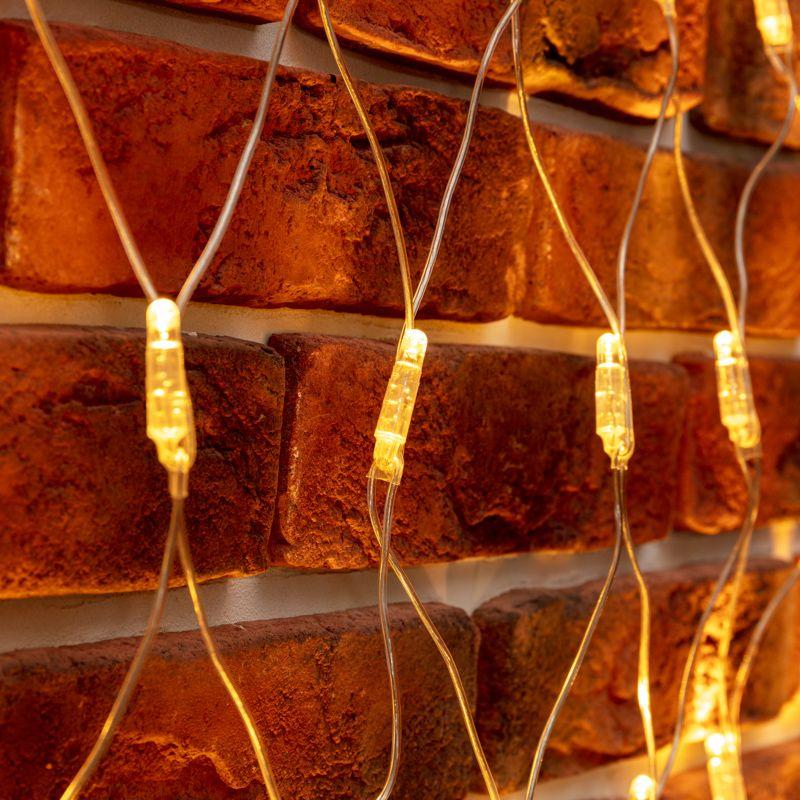  Гирлянда светодиодная "Сеть" 2х2х1.5м 136LED тепл. бел. 10Вт 230В IP65 свечение с динамикой провод ПВХ прозр. Neon-Night 215-056 фото в каталоге от BTSprom.by